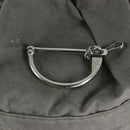 Close-up of metal lock mechanism on genuine German army sea sack duffel bag with green fabric background