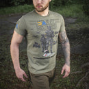 Man wearing olive green M-TAC military style t-shirt with Ukrainian flag and graphic design outdoors