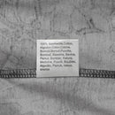 Close-up of a fabric label on a grey military-style T-shirt showing 100% cotton material in multiple languages
