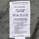 Care label inside Mil-Tec German army waterproof GoreTex Flecktarn field jacket showing fabric and care instructions