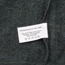 Close-up of fire-resistant balaclava fabric label showing 85% Modacrylic and 15% Cotton material composition.