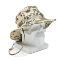Original German Army tropical camo boonie hat with ventilation holes and chin strap on white mannequin head display