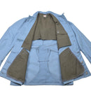 Inside view of original light blue Swedish Civil Defense uniform jacket with reinforced olive lining and pockets