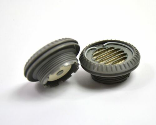 Close-up of two original Czechoslovakian military gas mask M-10 filter parts from the Cold War era.