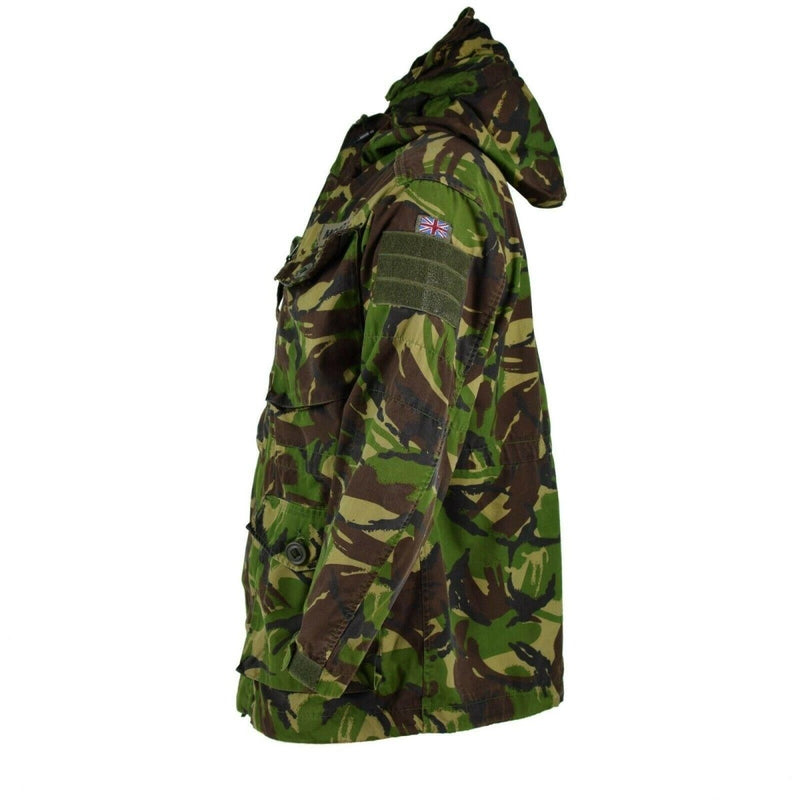 Side view of a genuine British military DPM camouflage combat smock jacket with hood and pockets