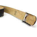 Close-up of genuine German army black leather belt showing metal buckle and leather quality markings inside strap
