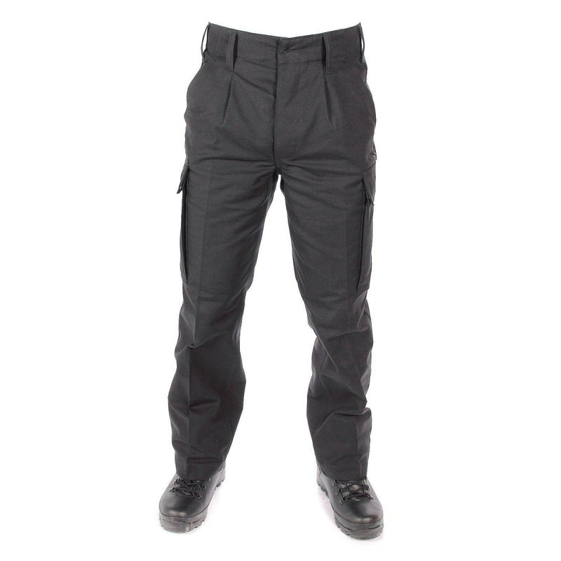 Front view of genuine German Army black moleskin cargo pants with belt loops and secure pockets on a white background