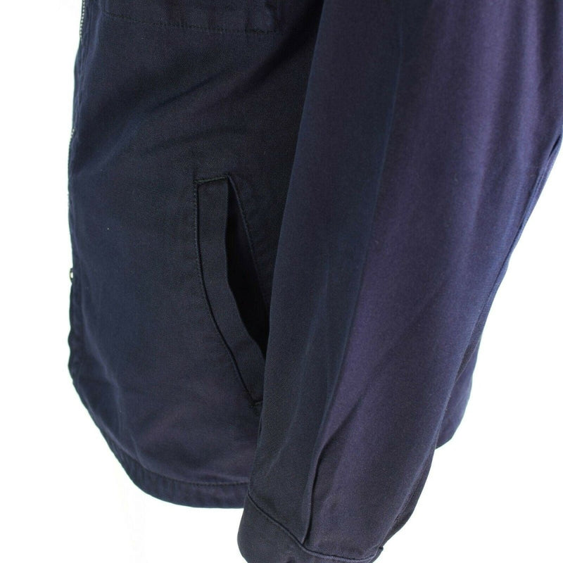 Close-up of blue German Navy Marines jacket sleeve and side pocket made from fire-resistant aramid material.