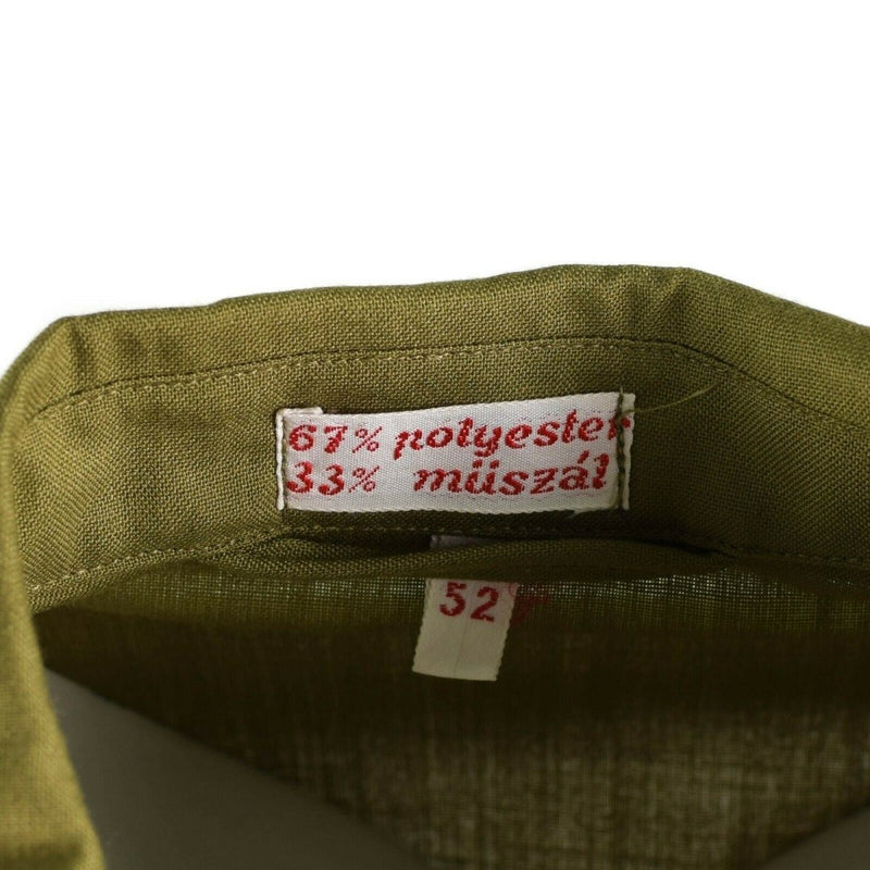 Close-up of khaki Hungarian military shirt collar showing polyester and műszál fabric label and size 52 tag.