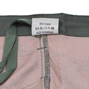 Close-up of the inside label on Hungarian military M1990 field pants showing 100% cotton and made in Hungary.