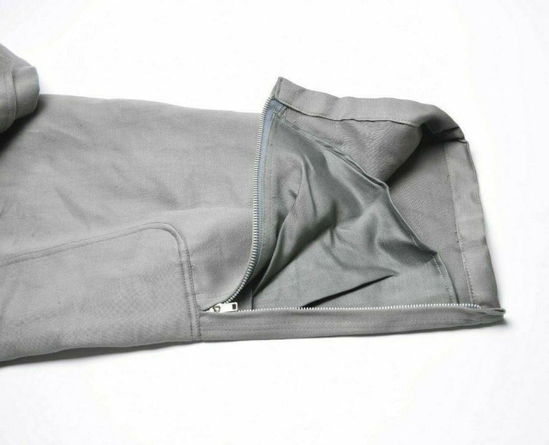 Close-up of military grey Genuine Italian Army coverall suit showing zippered ankle cuff and durable cotton blend fabric detail.