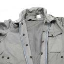 Close-up of genuine Italian Army military grey coverall suit with zip-front and button details on collar and pocket