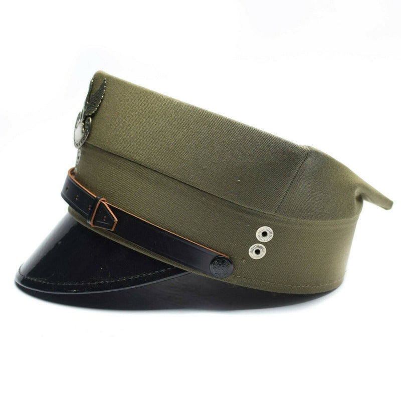 Vintage olive green Polish military officer peaked cap with black visor and eagle insignia on front