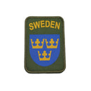 Sweden military patch with three golden crowns on blue shield and olive green background with SWEDEN text.