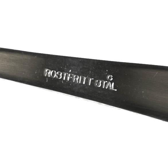Close-up of the stamped inscription "ROSTFRITT STAL" on genuine Swedish army stainless steel soup spoon handle