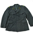 Vintage Swiss army wool jacket in gray with military insignia, pockets, and button detailing for warmth and style.