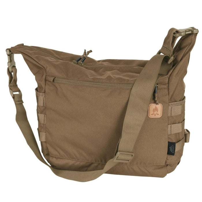Tan Helikon-Tex Bushcraft Satchel shoulder bag with MOLLE panels, adjustable strap, and multiple zippered pockets for outdoor use