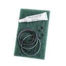 Katadyn Combi maintenance kit with 8 O-rings, silicone lubricant tube, and cleaning pad for water filter upkeep.
