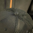 Close-up of black mesh back tactical baseball cap with breathable design and durable fabric stitching detail