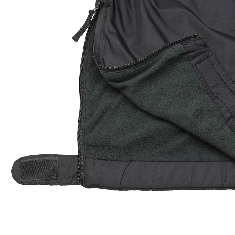Close-up of black MFH thermal jacket with fleece lining, zipper, and adjustable velcro strap.