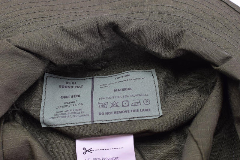 Inside view of Mil-Tec olive ripstop boonie hat showing care label and fabric details.