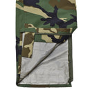 Detail of MIL-TEC military style waterproof windproof pants with camouflage pattern and inner lining visible