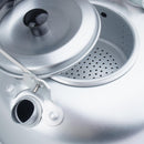 Close-up of MIL-TEC lightweight aluminum camping teakettle with built-in tea strainer and lid open