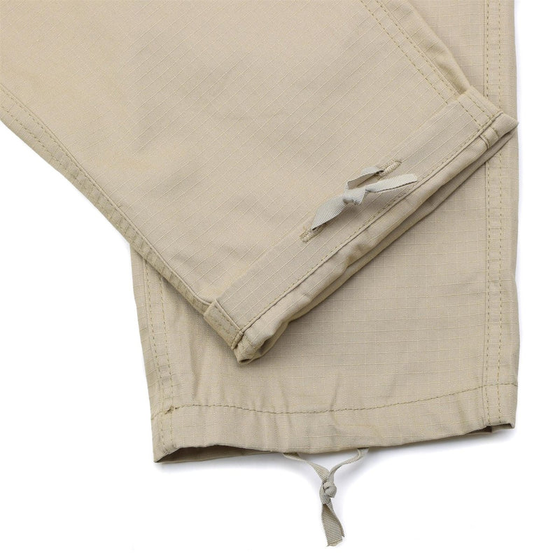 Close-up of khaki Mil-Tec US Army style field pants cuff with adjustable drawstring detail and ripstop fabric texture.