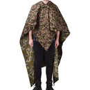 Person wearing vintage Austrian army water-resistant pea dot splinter camo poncho tent with corner ties