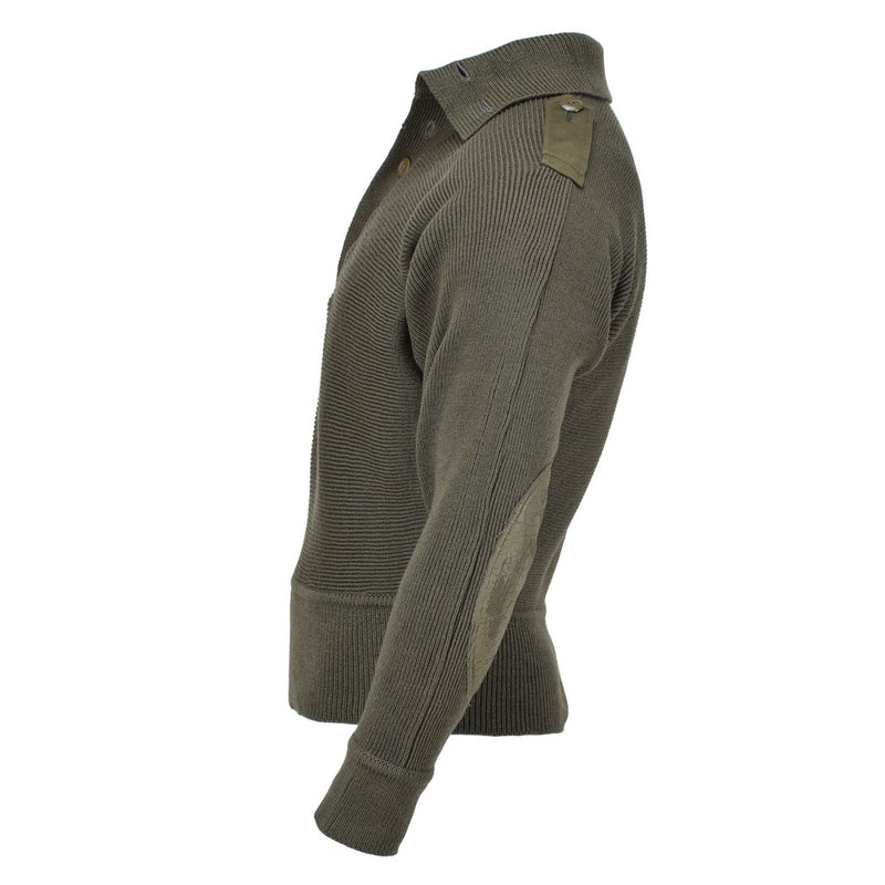 Green ribbed sweater on a white background