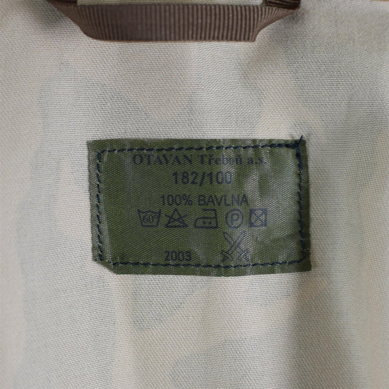 Close-up of the label inside the Original Czech army desert camo windproof parka jacket showing fabric and care details.