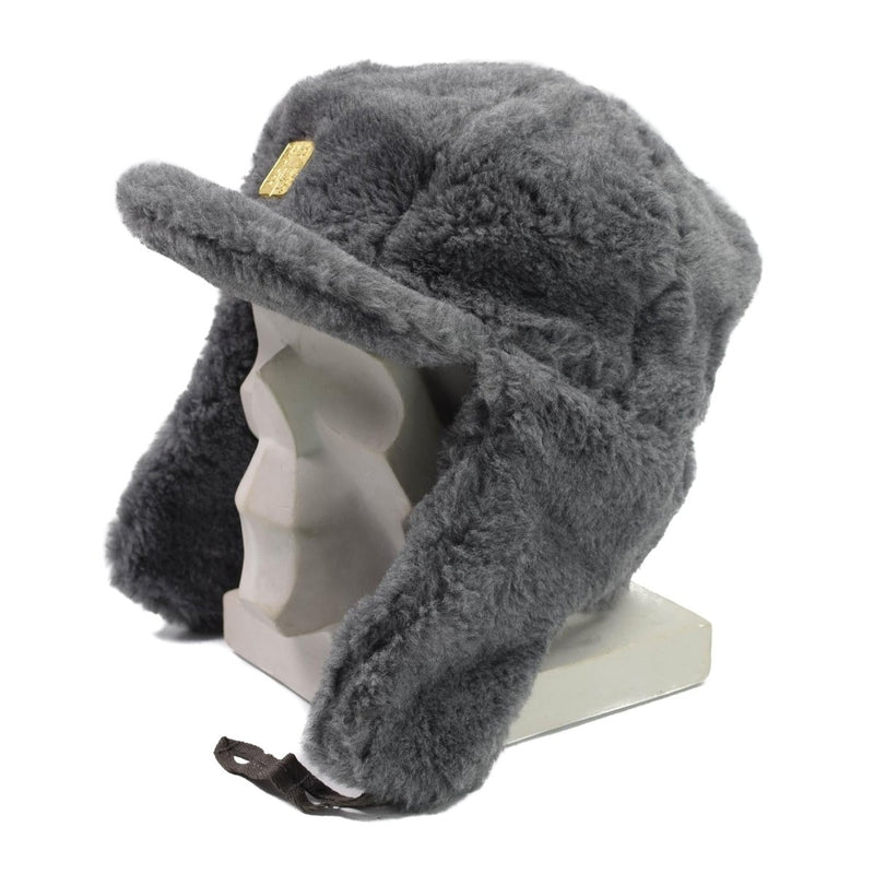 Gray Czech Republic army faux fur winter hat with earflaps and gold-toned insignia on a display mannequin head