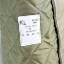 Quilted polyester lining inside Original Dutch Army mens khaki trench coat with care label tag visible.