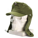 Original East German NVA M-43 style army cap with fold-down earflaps and metal badge in olive green fabric