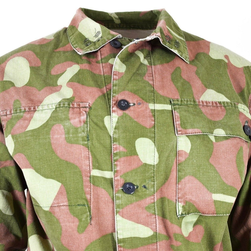 Close-up of original Finnish army M-62 reversible camo uniform jacket in large size with green and brown pattern