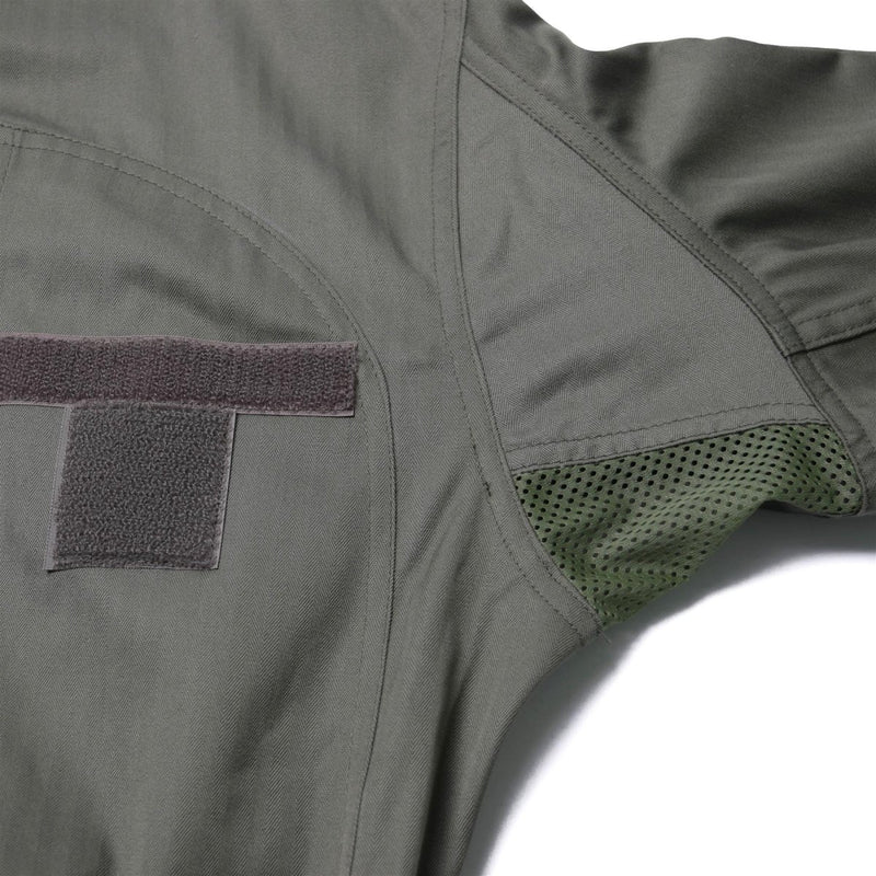 Close-up of durable olive green Original French Air Forces F2 flight suit fabric with ventilation and Velcro patch detail
