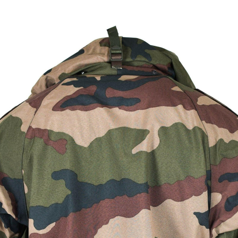 Close-up of the back of a French military waterproof trilaminate rain jacket in CCE camouflage pattern with hood and strap detail