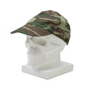 Greek army field cap in lizard camo pattern displayed on a white mannequin head for military surplus gear.