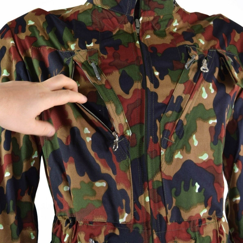 Close-up of Swiss army Alpenflage coverall suit with zippered chest pockets and camouflage pattern.
