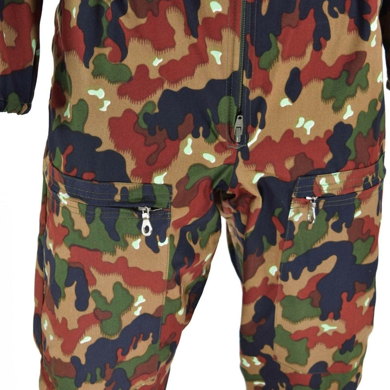 Close-up of Swiss army Alpen coverall suit with TAZ 83 camouflage, zipper front, and multiple zippered pockets.