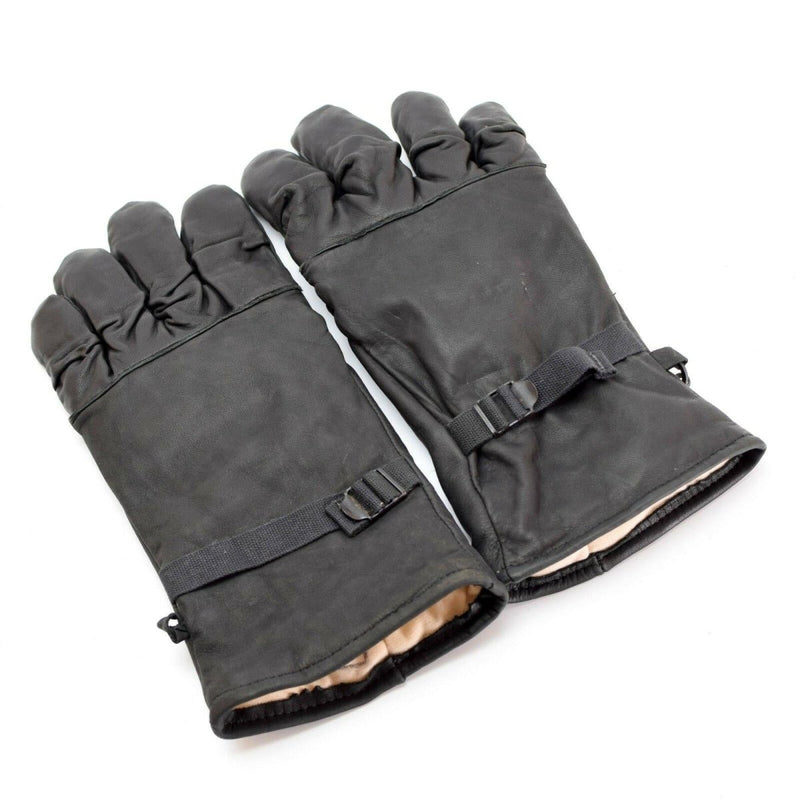 Pair of genuine black leather US Army combat gloves with insulated lining and adjustable wrist straps for secure fit.