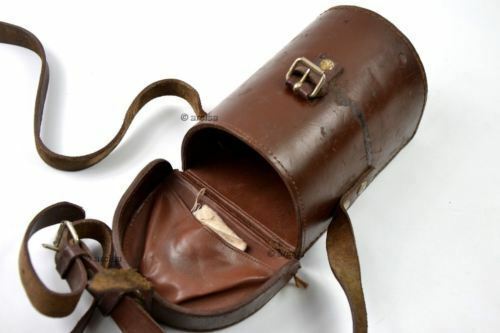 Vintage brown leather carrying case for Original Yugoslavian army ON-M59 monocular sight tool with strap and buckle closure.