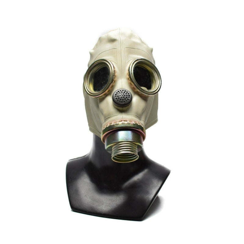Vintage Polish MP3 gas mask from the 1970s with round eye lenses and front filter attachment on display bust.