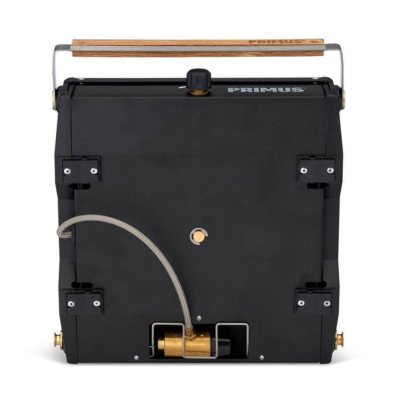 Compact Primus Moja outdoor camping stove with gas burner, wooden handle, and durable black metal body for hiking kitchens.