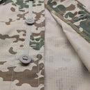 Close-up of TACGEAR Desert Flecktarn camo combat shirt showing button details and durable ripstop fabric texture.